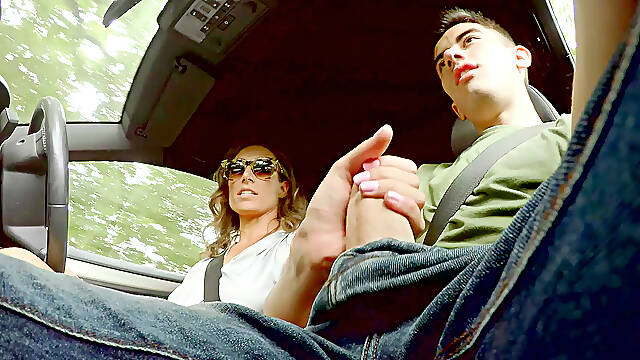 Ava Austen strokes hitchhiker Jordis massive cock while driving the car