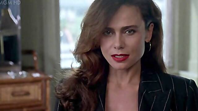 Brunette Lena Olin in lingerie shows off her small tits