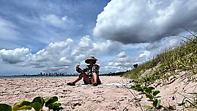 Milf flashing hairy pussy on public beach