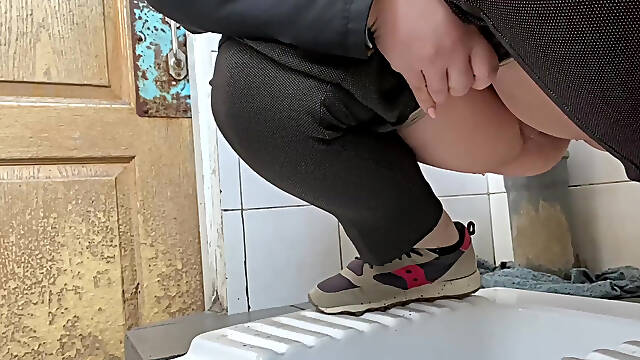 Mature milf pees in a hospital public toilet